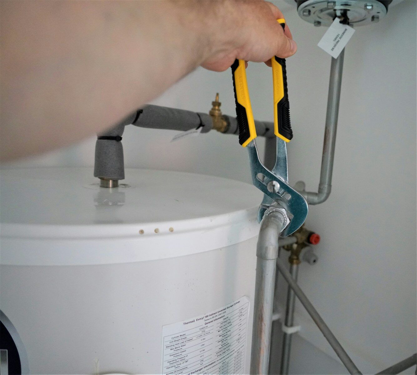 Heat pump water heater installed in a home utility area