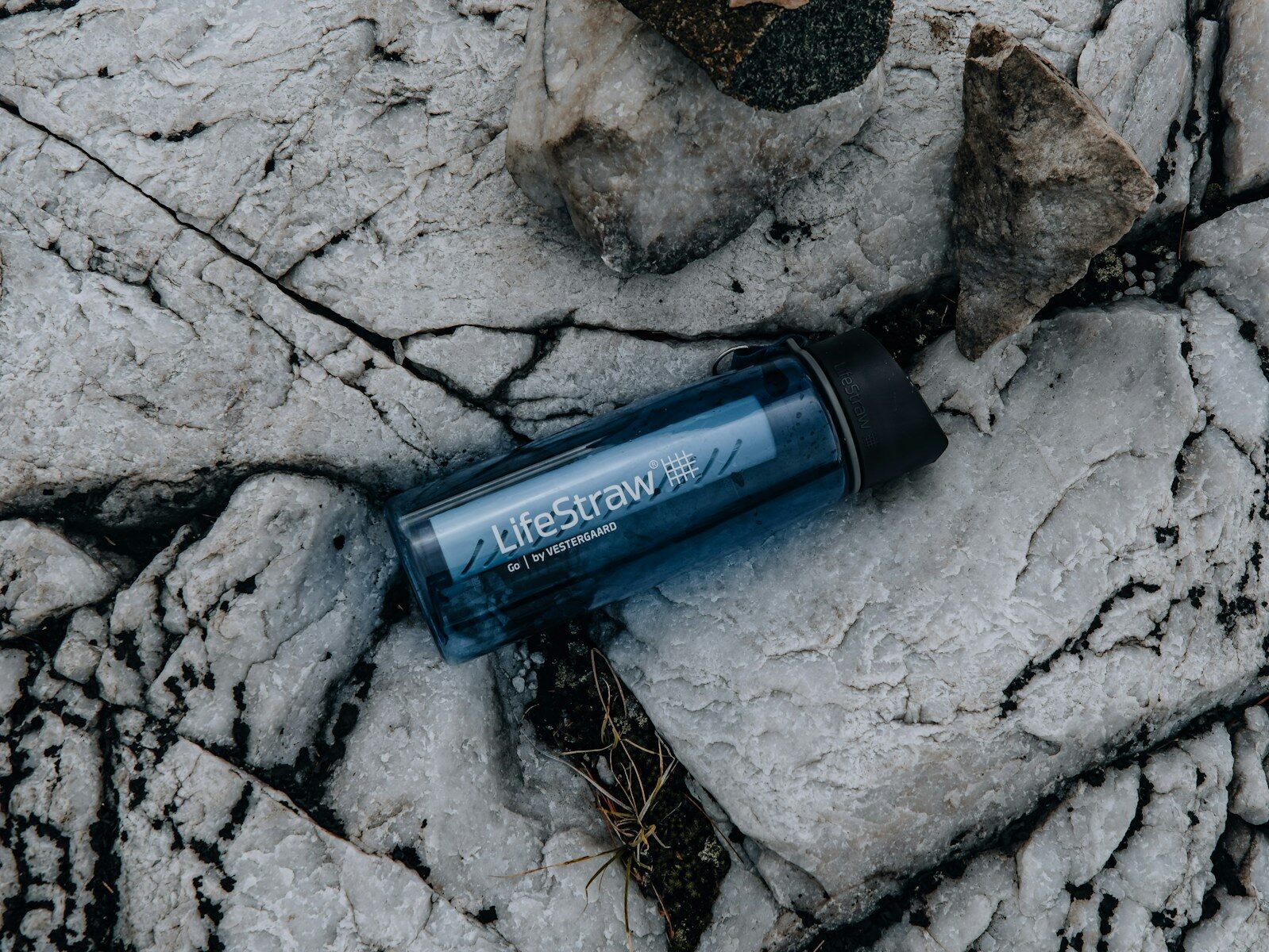 Backpacking water filter and clean-water gear used to treat water at a campsite