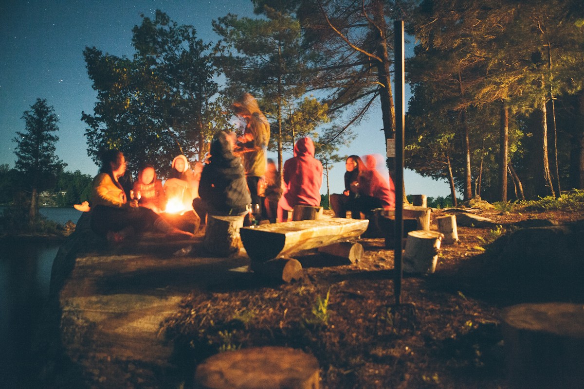 Tent in a wooded campground with autumn trees